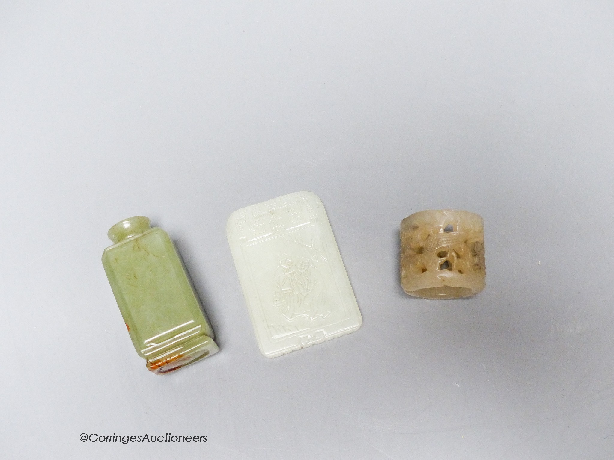 A Chinese jade archer's ring, snuff bottle and plaque, 2.7 - 6cm